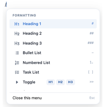 The / menu at the top, showing the Formatting section from Heading 1 through Toggle